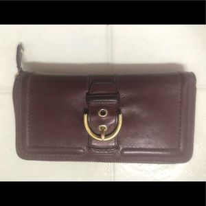 Burgundy colored Coach wallet